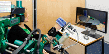Image: Study participant training with the ARMin therapy robot (Photo courtesy of Dietmar Heinz, ETH).
