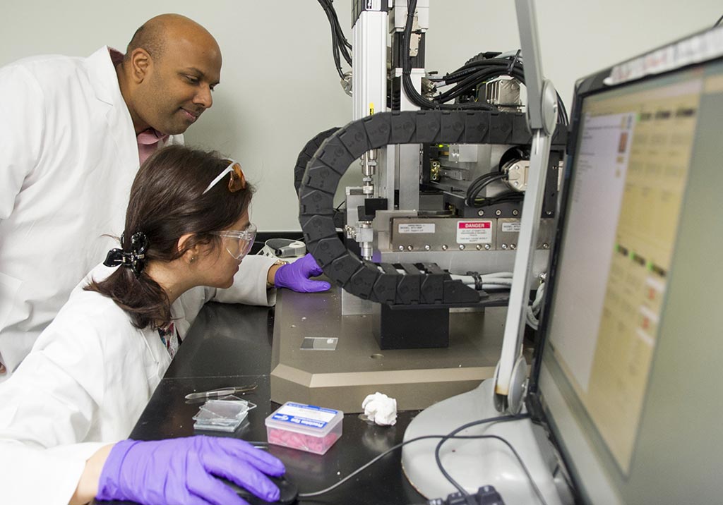 Image: Dr. Venu Varanasi and Research Assistant Tugba Cebe set the coordinates for the 3D printer (Photo courtesy of TAMU).