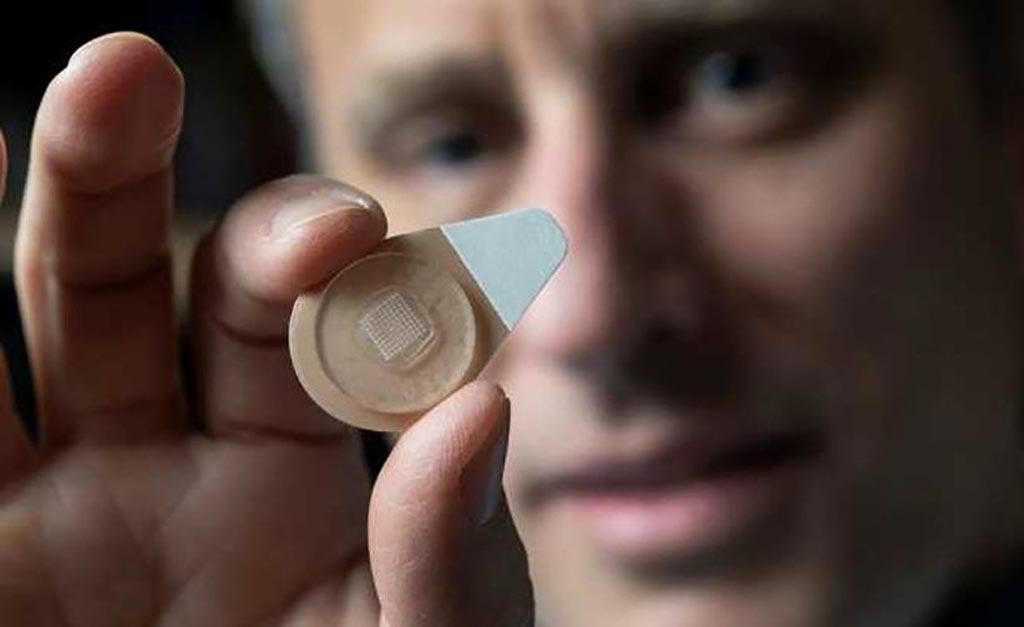 Image: Professor Mark Prausnitz holds an experimental microneedle contraceptive skin patch (Photo courtesy of Christopher Moore/Georgia Tech).