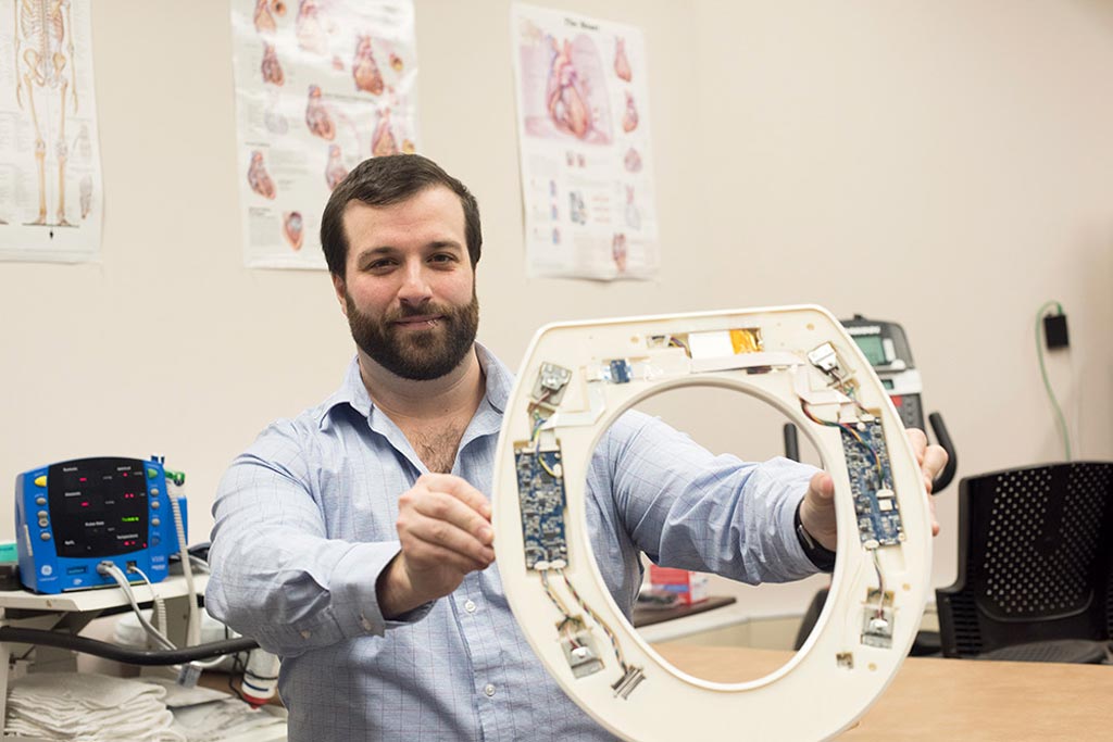 Image: Nicholas Conn presenting the toilet-seat based cardiovascular monitoring system (Photo courtesy of Sue Weisler/ RIT).