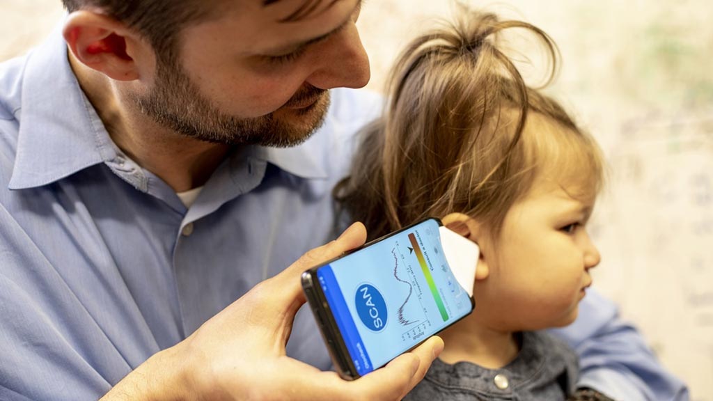 Image: Dr. Randall Bly of Seattle Children\'s Hospital checking his daughter\'s ear (Photo courtesy of Dennis Wise/ UW).