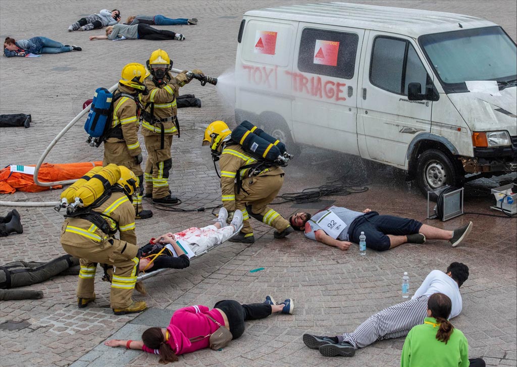 Image: Firefighters treat the injured during the TOXI-Triage mass casualty field trial (Photo courtesy of Andy Weekes/Loughborough University).