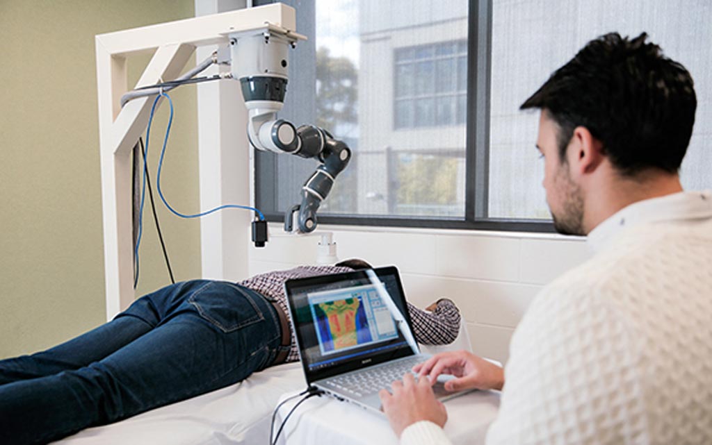 The PBM cobot applies targeted laser therapy to pain hot spots (Photo courtesy of Swinburne Institute of Technology).