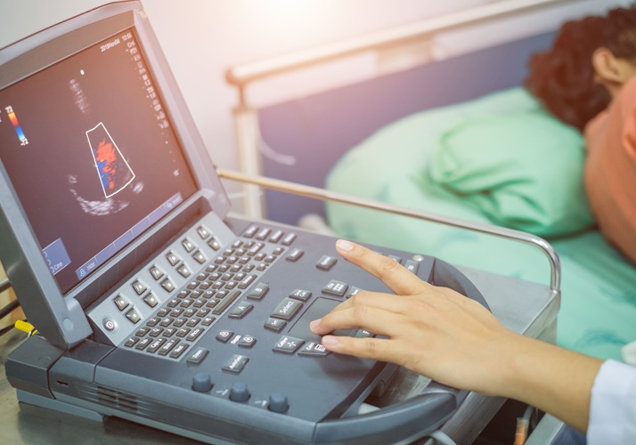 Image: A clinician performing an echocardiogram of a patient\'s heart (Photo courtesy of Adobe Stock)