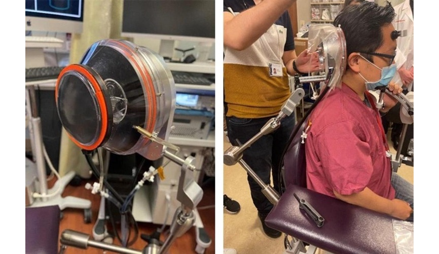 Image: A researcher demonstrates the positioning of the focused ultrasound transducer for an adult patient (Photo courtesy of Elisa Konofagou)