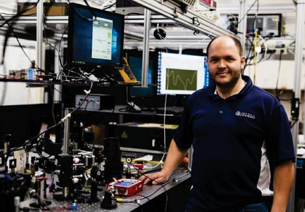 Image: Assistant Professor Shawn Putnam, PhD, of UCF\'s College of Engineering & Computer Science in his laboratory with the frequency-domain Faraday rotation spectroscopy (Photo courtesy of the University of Central Florida).