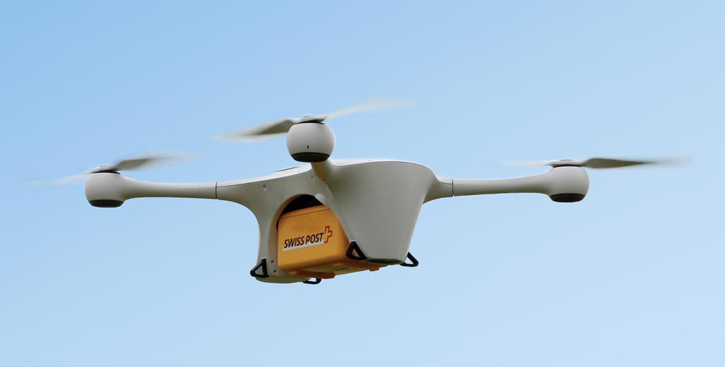 Image: A quadrocopter drone transporting a biological safety box (Photo courtesy of Swiss Post).