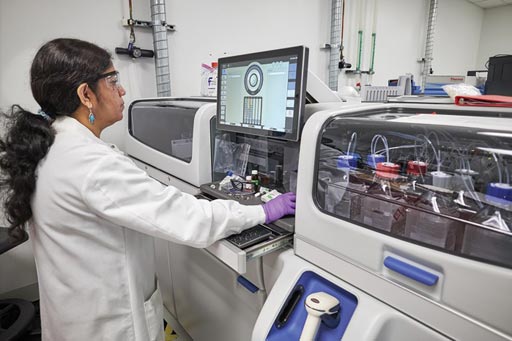 Image: An operator stands at the control screen of the Cascadion clinical analyzer (Photo courtesy of Thermo Fisher Scientific).
