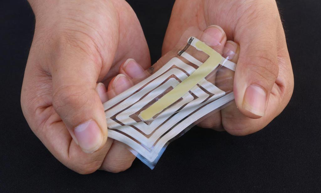 Image: Researchers used metallic ink to screen-print an antenna and sensor onto a stretchable sticker designed to adhere to skin and track pulse and other health indicators, and transmit these readings to a receiver on a person\'s clothing (Photo courtesy of Bao Lab, Stanford University).
