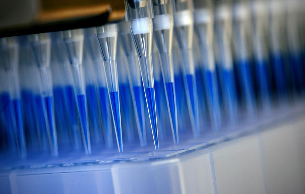 Image: Blue-stained swab material from corona tests is prepared for analysis in a sequencing device with the help of a laboratory robot (Photo courtesy of Felix Heyder / University Hospital Bonn)