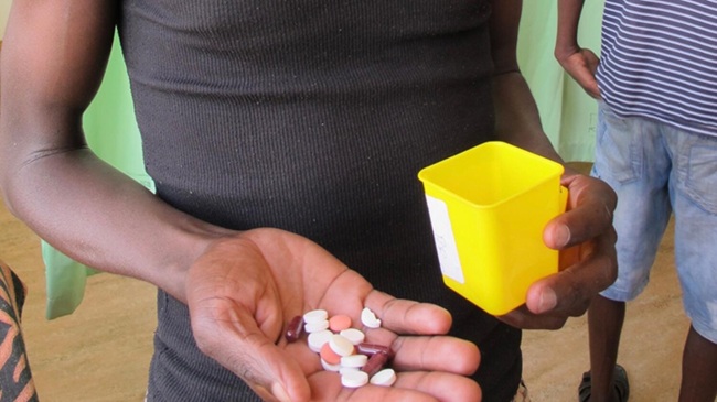 Image: A patient in Namibia receives his daily ration of tuberculosis medication (Photo courtesy of Christoph Lange/DZIF)