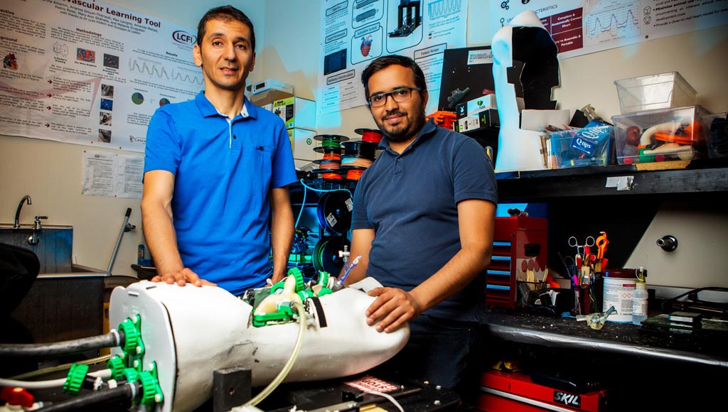 Image: Professor Lyes Kadem (L) and the custom double-activation left heart duplicator (Photo courtesy of Concordia University).